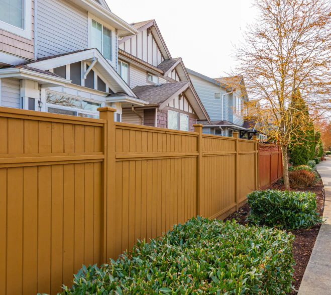 residential house with new wooden fence