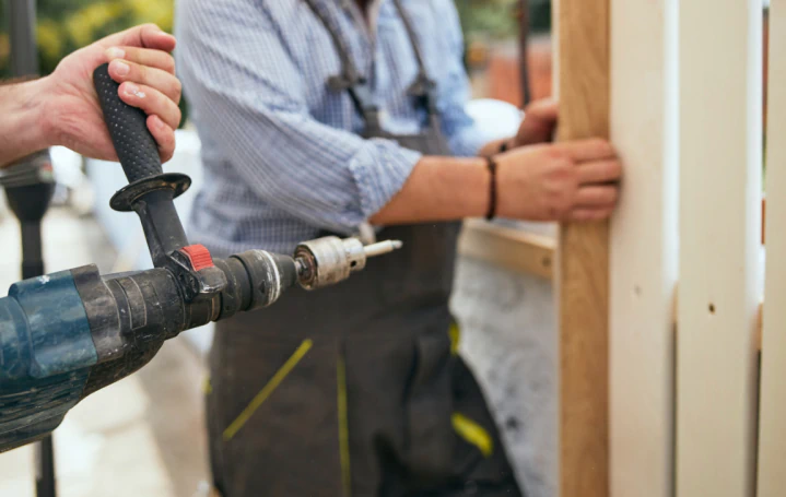 workers installing wooden fence